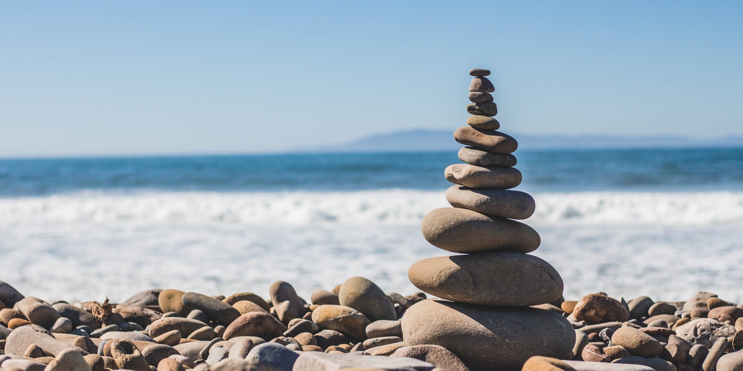 pebble tower A tower of rocks or pebbles by the sea. Clear day.